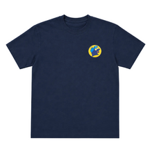 Load image into Gallery viewer, A navy blue short-sleeve crewneck t-shirt with a small circular graphic on the left chest featuring a blue and yellow globe design, displayed on a light gray background.
